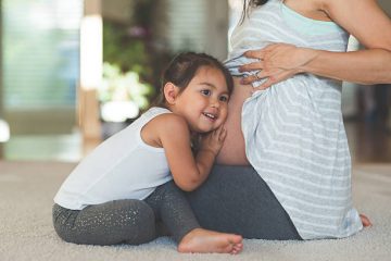 pregnant woman with daughter