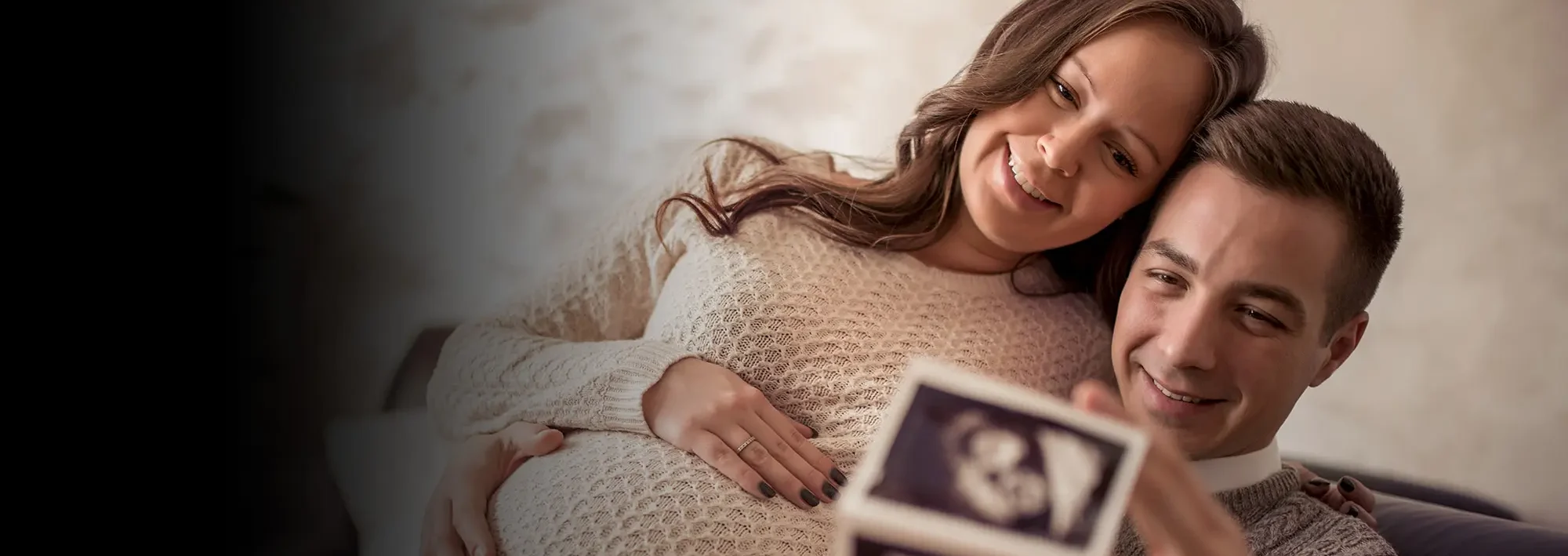 A couple looking at a sonogram
