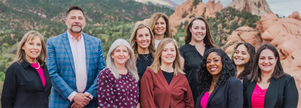 Group of people standing together in front of Garden of the Gods