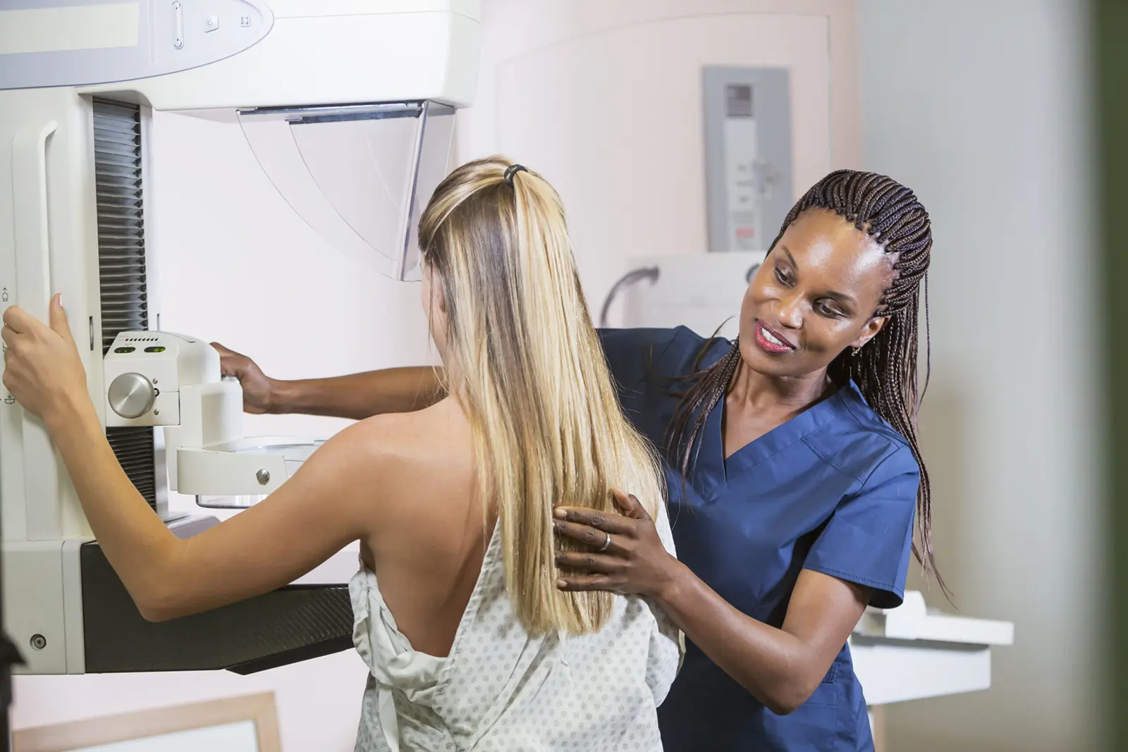 A woman getting a mammogram