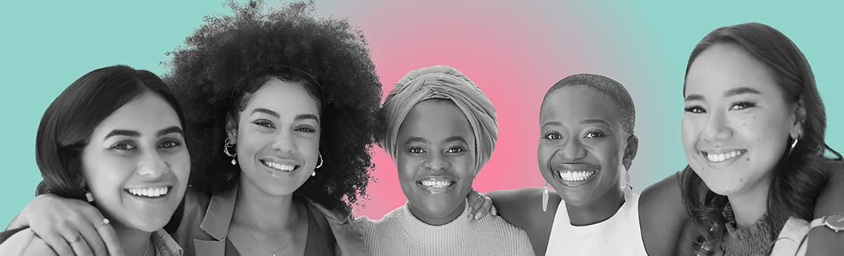 Group of diverse women standing side by side with their arms around one another.
