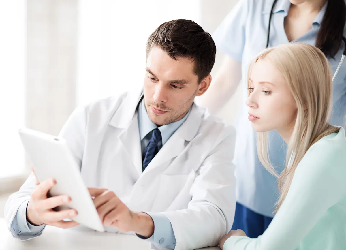 A patient discussing with a radiologist.