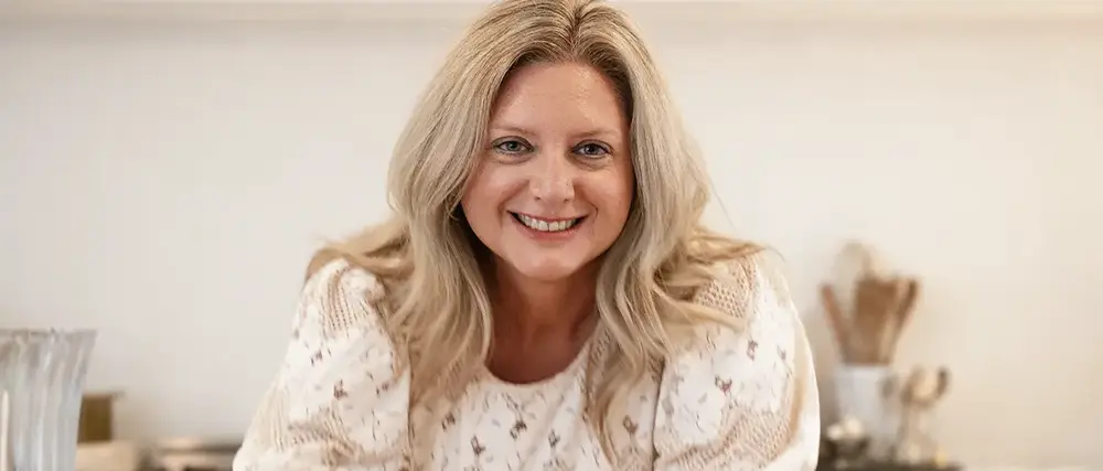 Julie Dixon, cancer survivor, happy and smiling.