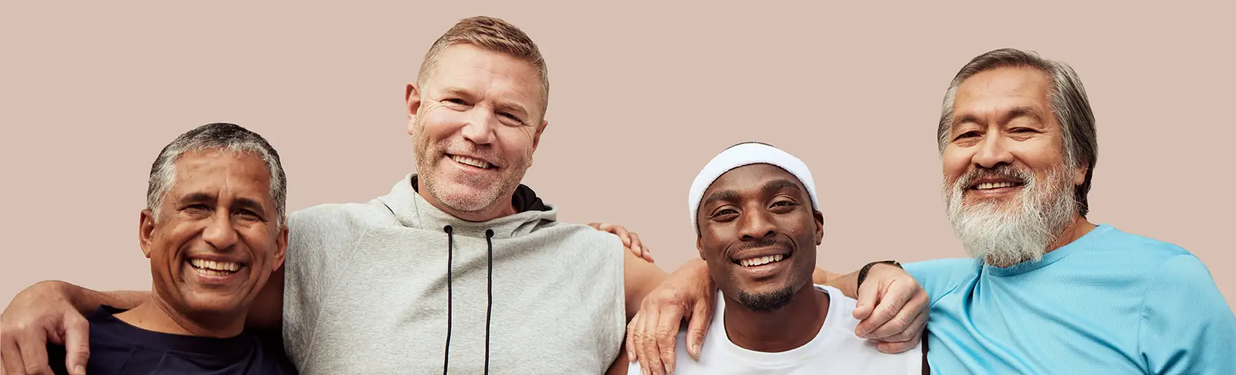 Group of men in a line, side by side with their arms around each other's shoulders.