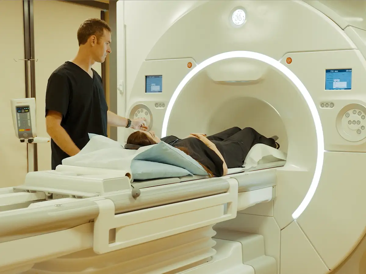 A patient lies in an MRI machine, preparing to be scanned.