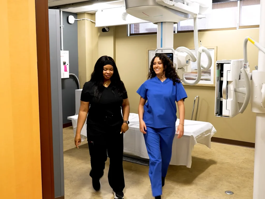 Team member walks with patient after the exam